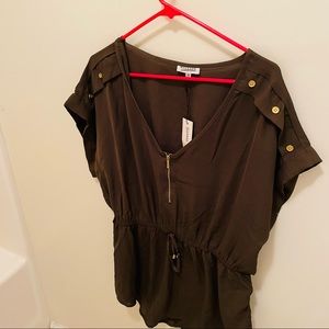 A beautiful blouse color I would say a dark green or brown